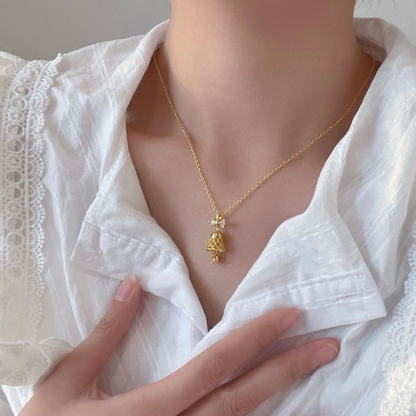 Gold Bell Necklace with Zircon Bow — Festive Pendant Jewelry